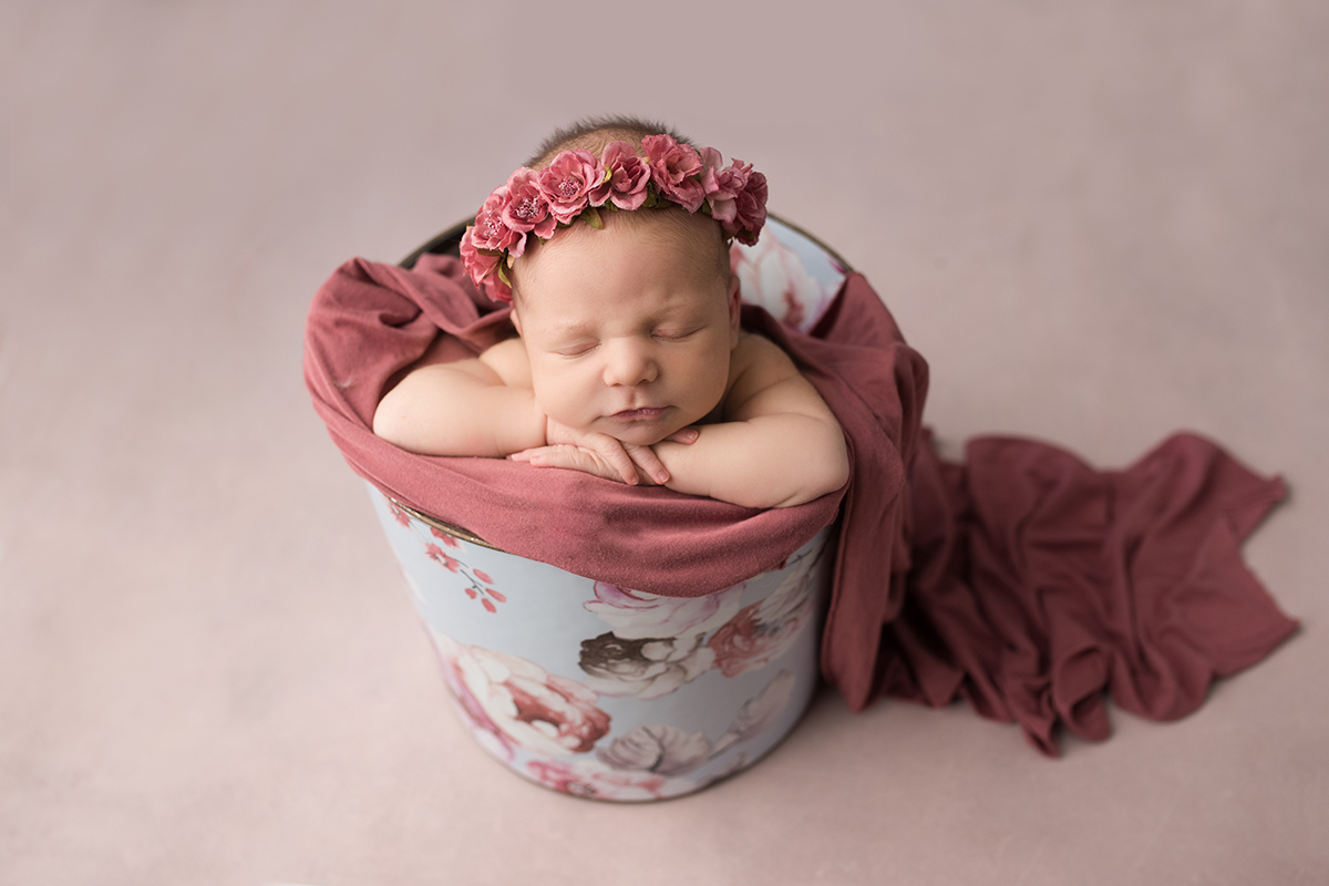 baby in bucket newborn pose