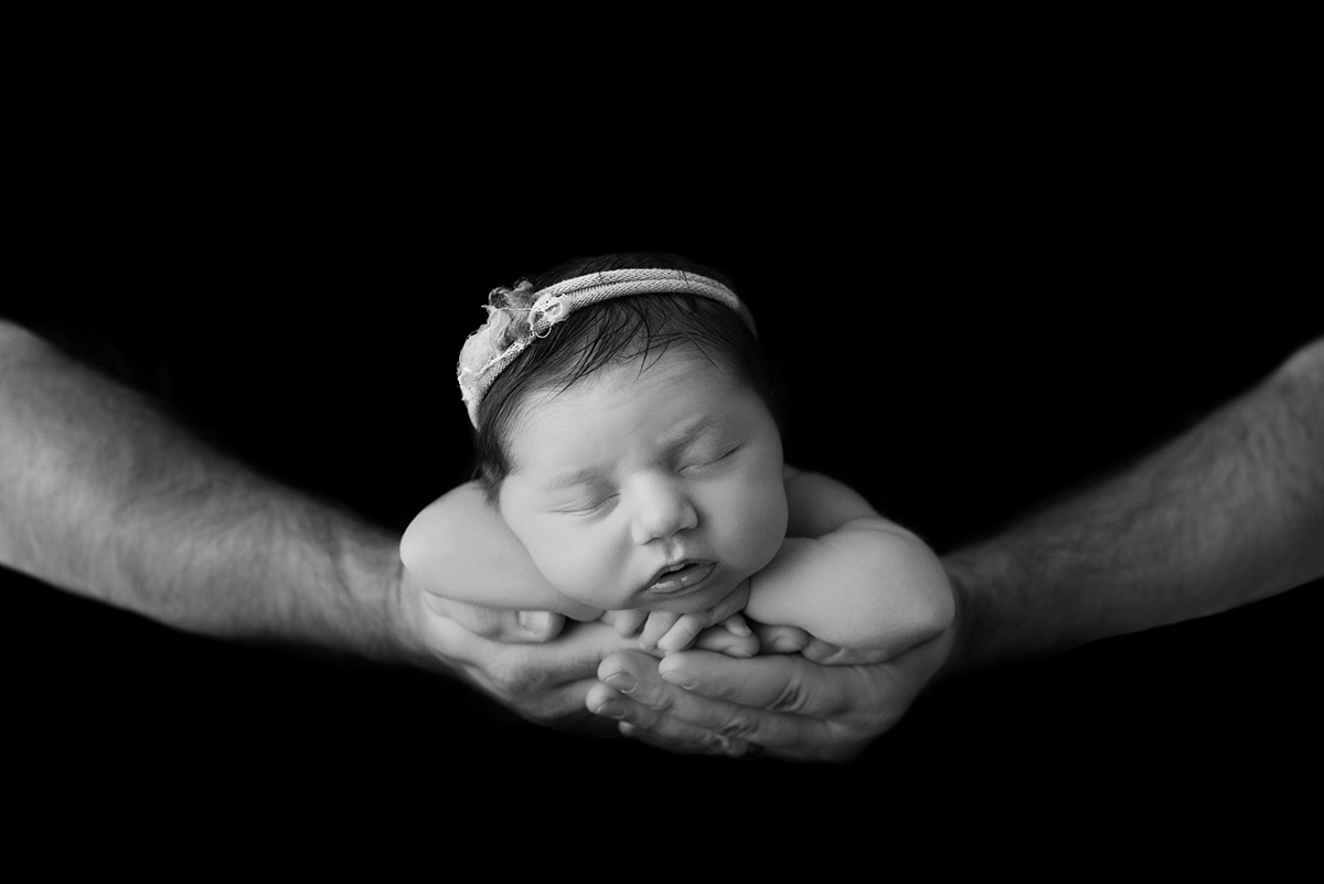 Newborn in dads hands
