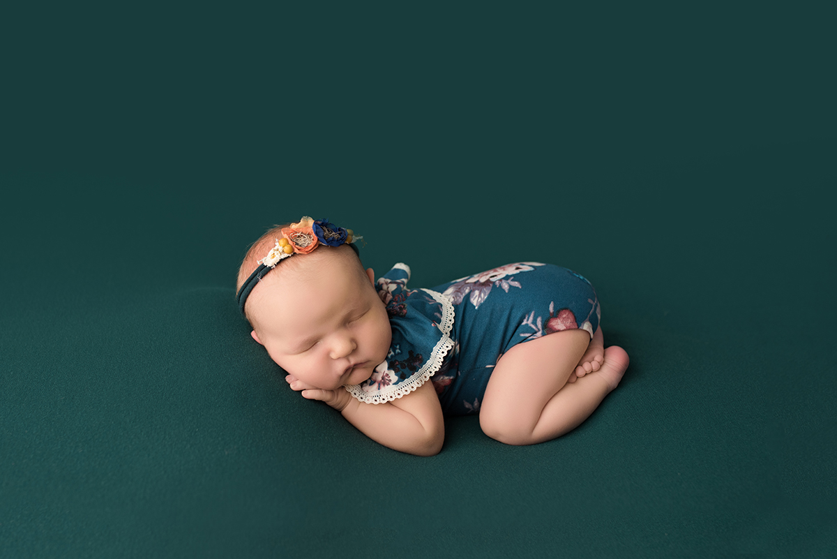 newborn in bottoms up pose