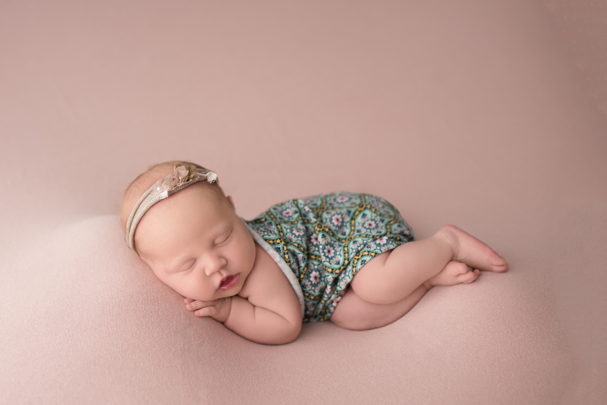 newborn in side laying pose