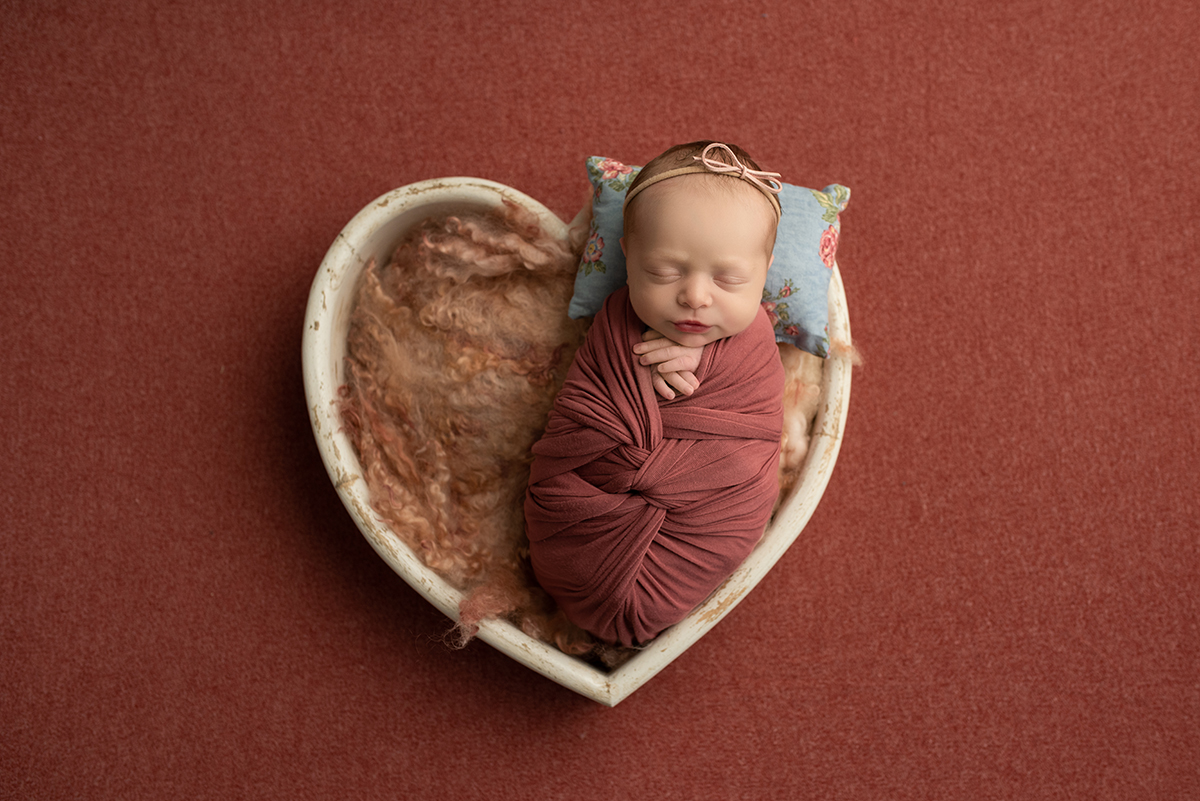 Newborn in heart bowl