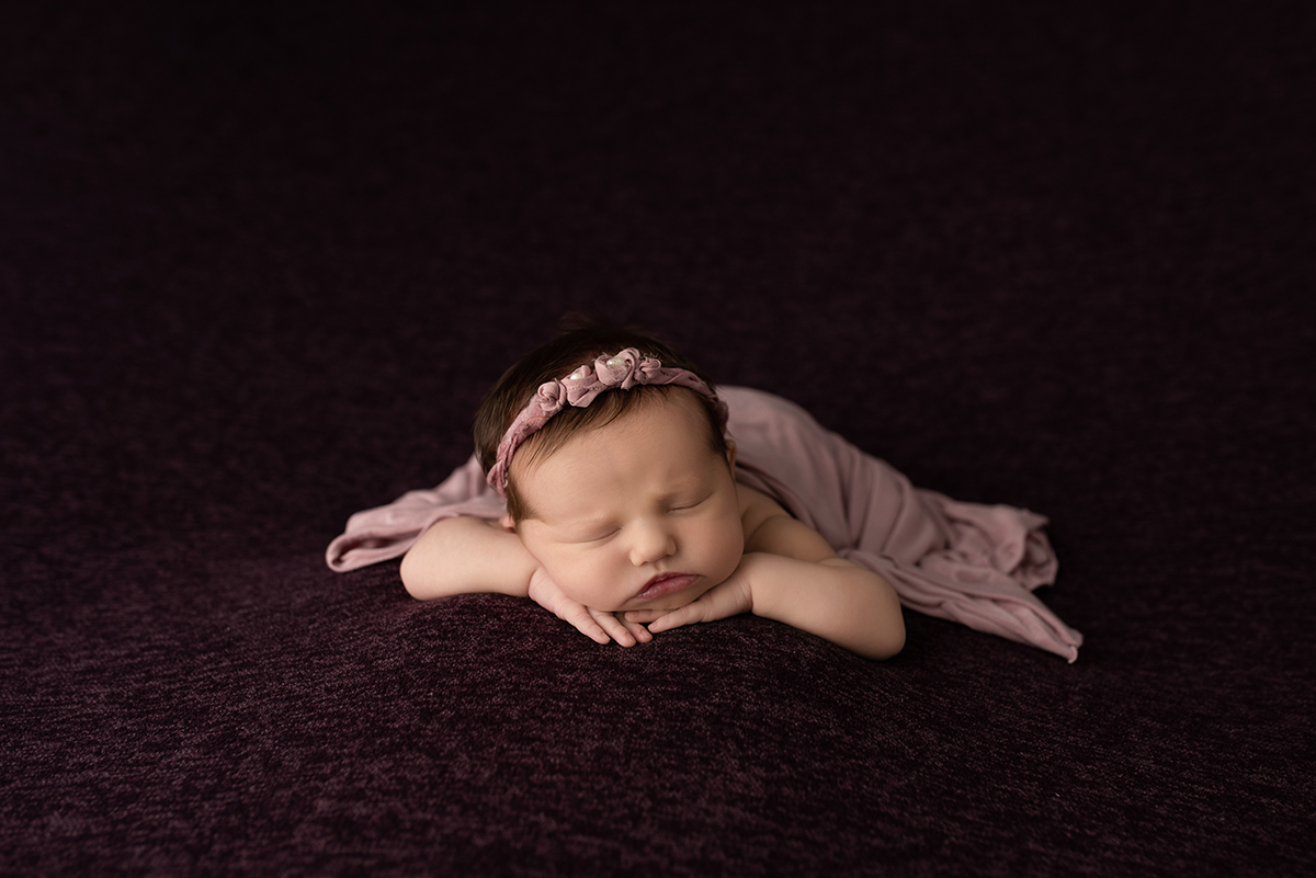 newborn during posed newborn photo session