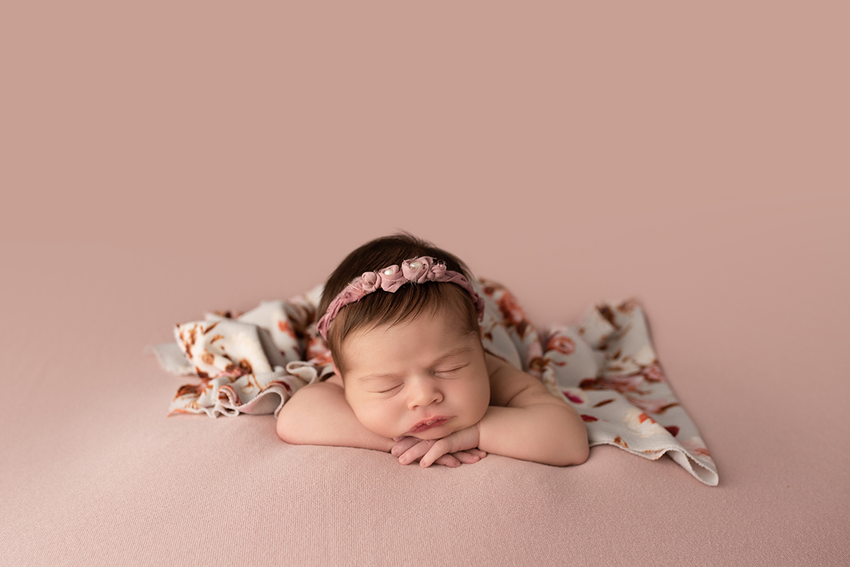 sleeping newborn during posed newborn photo session