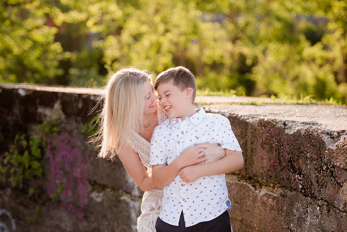 mom and son laughing during fun family photo session