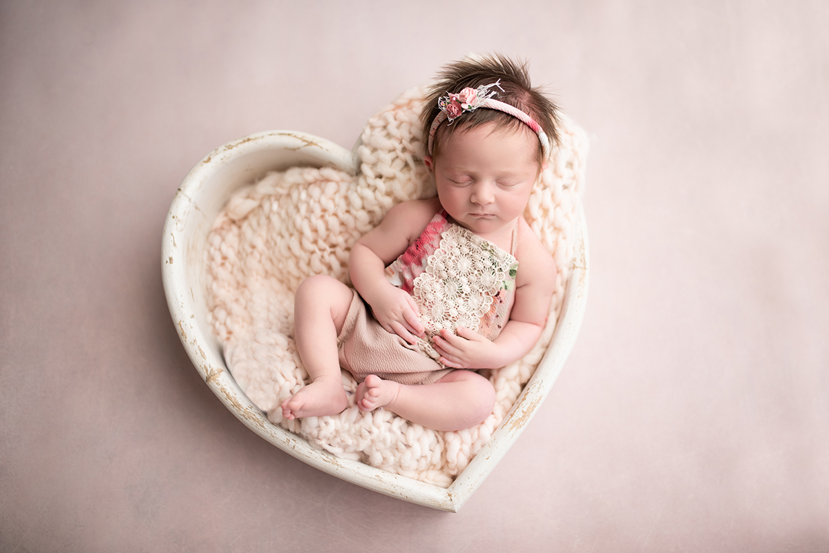 baby in heart bowl